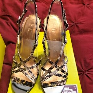 Brand new shoes black, white, and yellow never worn